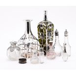 A COLLECTION OF SILVER MOUNTED AND OVERLAID GLASS BOTTLES