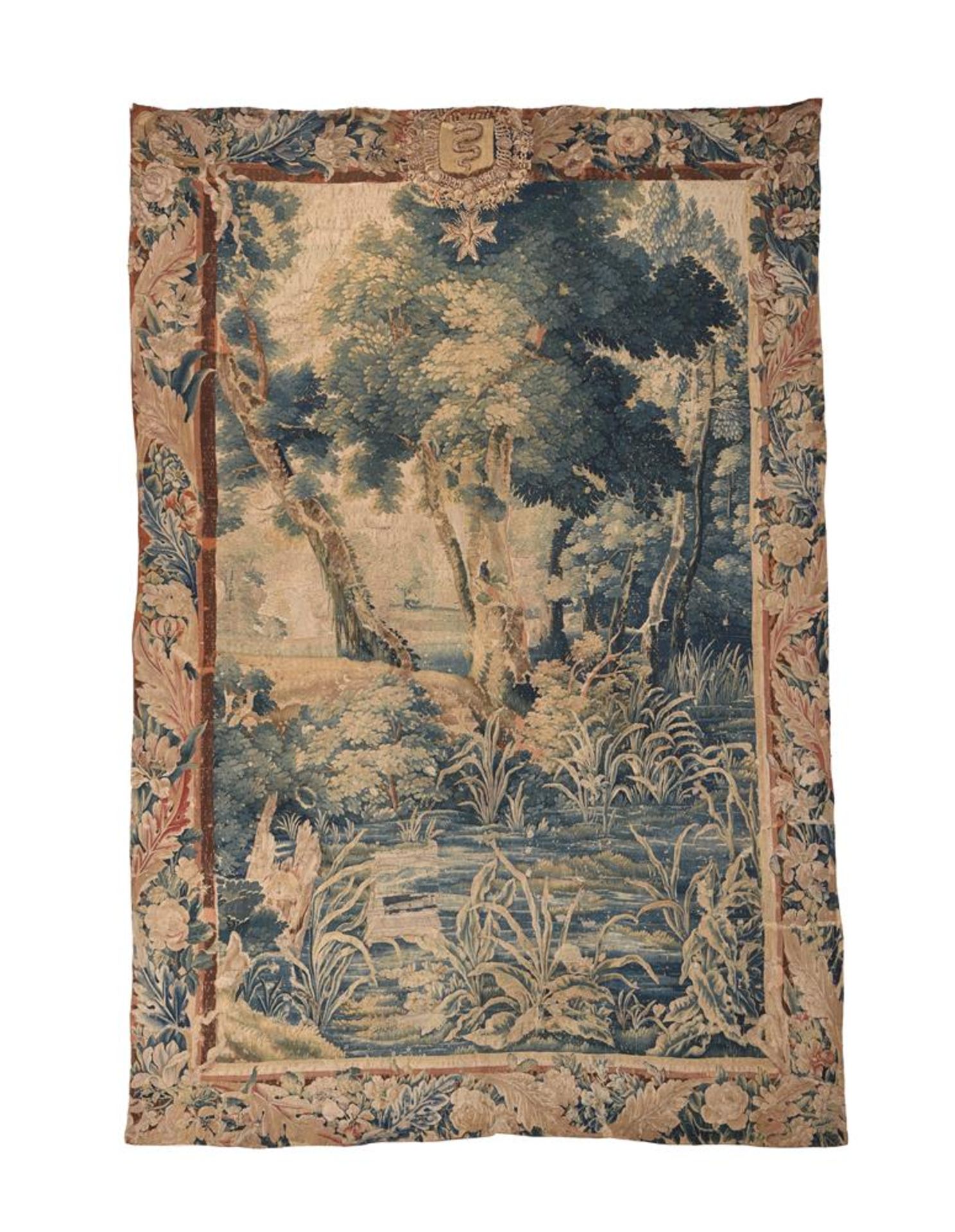 A FLEMISH ARMORIAL SURMOUNTED VERDURE TAPESTRY PANEL, LATE 17TH CENTURY