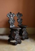 A PAIR OF ITALIAN CARVED WALNUT SGABELLO CHAIRS, LATE 16TH/EARLY 17TH CENTURY