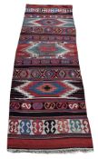 A NORTH WEST PERSIAN KILIM RUNNER, approximately 420 x 138cm