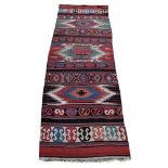 A NORTH WEST PERSIAN KILIM RUNNER, approximately 420 x 138cm