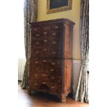 A GEORGE II FIGURED WALNUT SECRETAIRE CHEST ON CHEST, CIRCA 1740