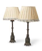 A PAIR OF BRONZE AND GILT TABLE LAMPS IN THE GOTHIC REVIVAL TASTE, 19TH CENTURY AND LATER