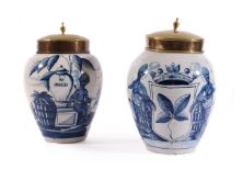 TWO SIMILAR DUTCH DELFT TOBACCO JARS AND TWO GILT METAL COVERS, LATE 18TH OR EARLY 19TH CENTURY