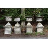 A SET OF FOUR LARGE STONE GARDEN URNS ON PEDESTAL STANDS, 20TH CENTURY