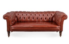 A VICTORIAN WALNUT AND BUTTONED RED LEATHER UPHOLSTERED 'CHESTERFIELD' SOFA, CIRCA 1870