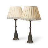 A PAIR OF BRONZE AND GILT TABLE LAMPS IN THE GOTHIC REVIVAL TASTE, 19TH CENTURY AND LATER