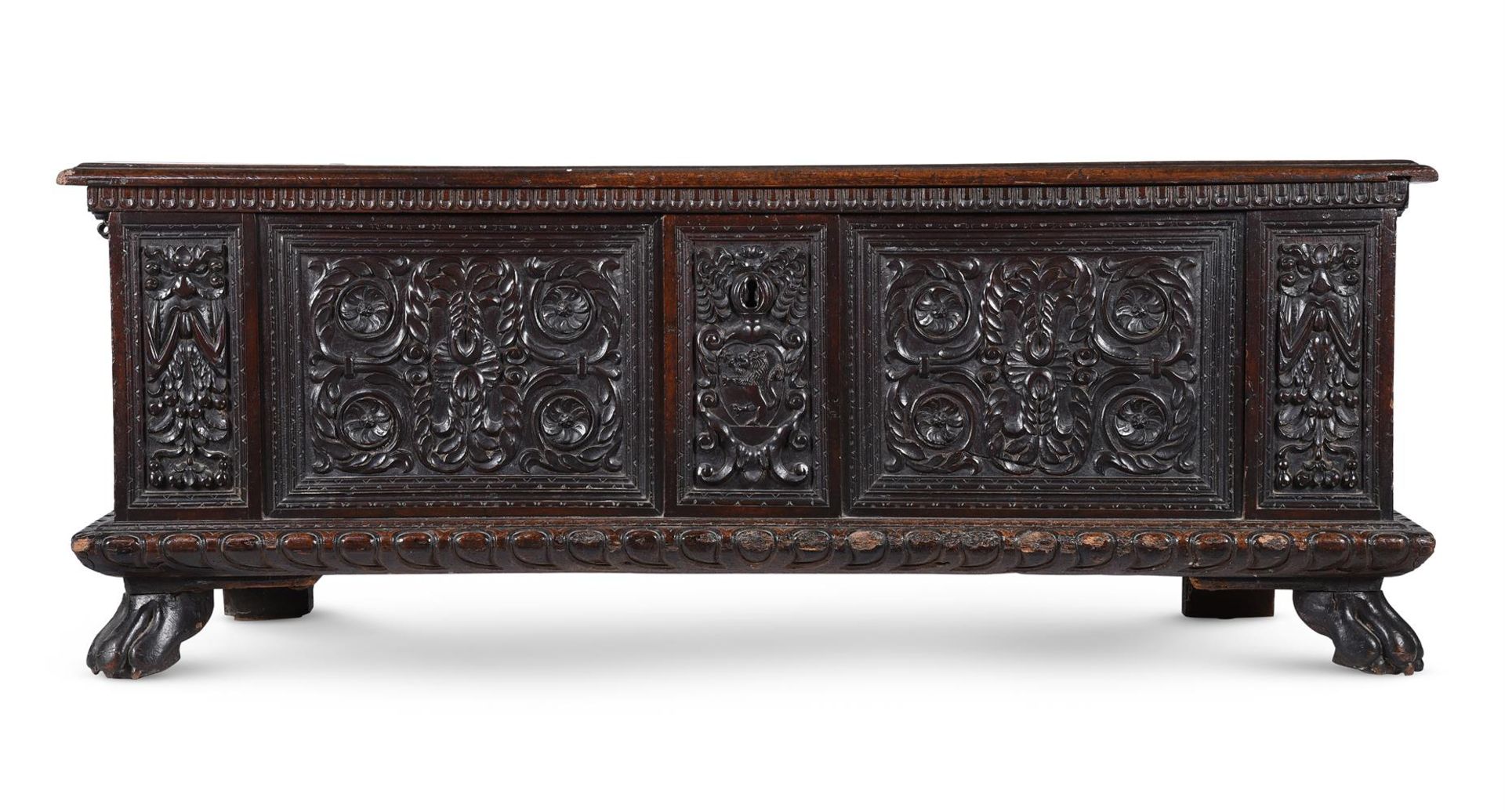 AN ITALIAN CARVED WALNUT CASSONE, CIRCA 1600