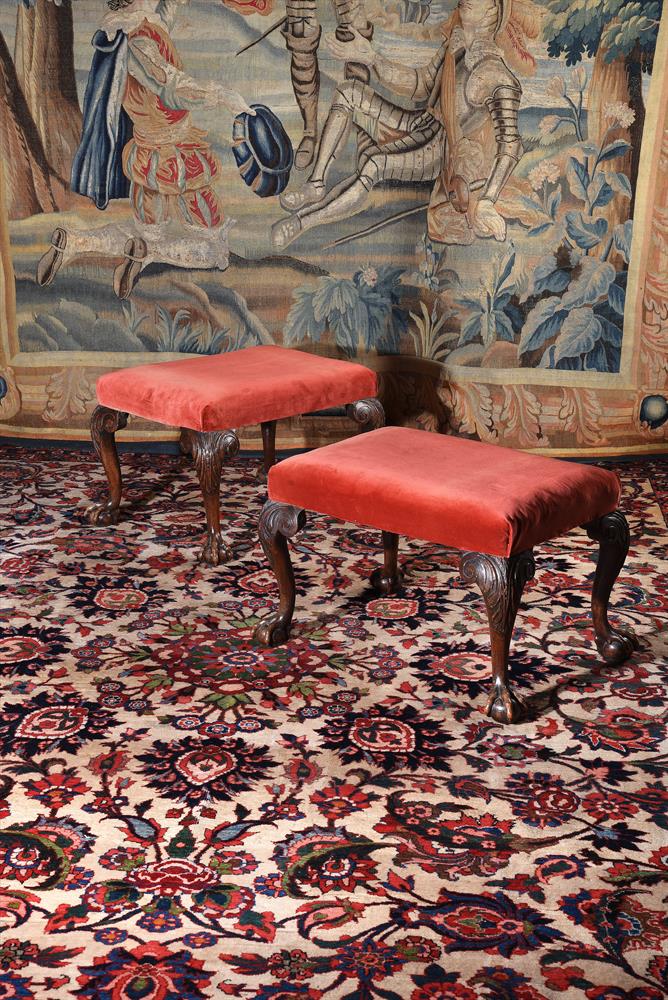 A PAIR OF GEORGE II CARVED WALNUT STOOLS, CIRCA 1740