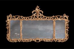 A GEORGE III CARVED GILTWOOD MIRROR, IN THE ROCCOCO MANNER, CIRCA 1760