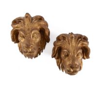A PAIR OF CARVED GILTWOOD LION MASKS, 18TH CENTURY