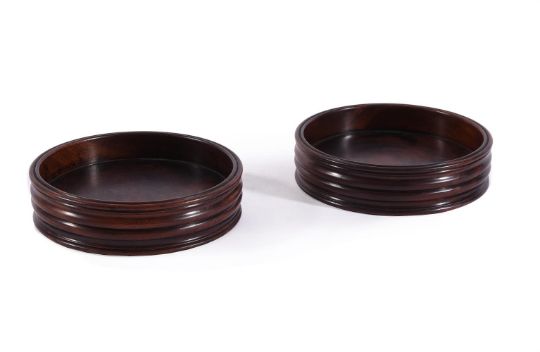 A PAIR OF TURNED MAHOGANY WINE COASTERS, IN GEORGE III STYLE