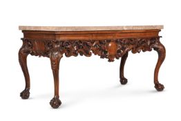 A CARVED WALNUT AND MARBLE MOUNTED CONSOLE TABLE, IN IRISH GEORGE II STYLE