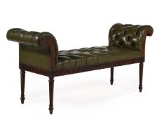 AN EDWARDIAN MAHOGANY AND BUTTONED GREEN LEATHER UPHOLSTERED STOOL OR WINDOW SEAT, CIRCA 1905