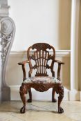 A GEORGE II CARVED WALNUT OPEN ARMCHAIR, ATTRIBUTED TO DANIEL BELL AND THOMAS MOORE, CIRCA 1735