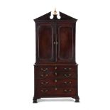 A GEORGE III MAHOGANY CABINET ON CHEST, IN THE MANNER OF THOMAS CHIPPENDALE, CIRCA 1770