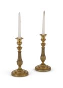 A PAIR OF FRENCH BRASS CANDLESTICKS, IN THE EMPIRE MANNER, LATE 19TH CENTURY