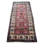 A NORTH WEST PERSIAN RUG, approximately 215 x 93cm