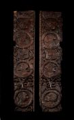 A RARE PAIR OF EARLY HENRY VIII CARVED OAK PANELS, CIRCA 1510-1530