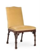 A GEORGE III CARVED MAHOGANY AND UPHOLSTERED SIDE CHAIR, IN THE MANNER OF THOMAS CHIPPENDALE