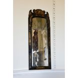 A QUEEN ANNE BLACK LACQUER AND GILT DECORATED WALL MIRROR, CIRCA 1710