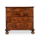 A QUEEN ANNE MULBERRY AND FEATHER BANDED CHEST OF DRAWERS, CIRCA 1710