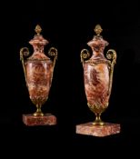A PAIR OF FRENCH RED FLUORSPAR AND GILT BRASS MOUNTED URNS, LATE 19TH CENTURY