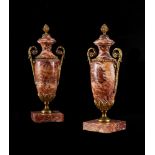 A PAIR OF FRENCH RED FLUORSPAR AND GILT BRASS MOUNTED URNS, LATE 19TH CENTURY