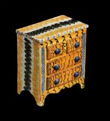 A PEARLWARE SPONGE-DECORATED MODEL OF A CHEST OF DRAWERS, POSSIBLY NORTH EAST ENGLAND