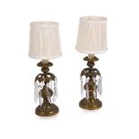 A PAIR OF GILT BRASS CANDLESTICKS, 19TH CENTURY AND LATER FITTED AS LAMPS