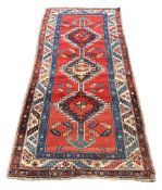 A NORTH WEST PERSIAN RUG, approximately 229 x 101cm