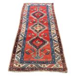 A NORTH WEST PERSIAN RUG, approximately 229 x 101cm