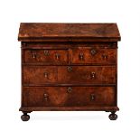 A QUEEN ANNE WALNUT AND FEATHER BANDED BUREAU, CIRCA 1705