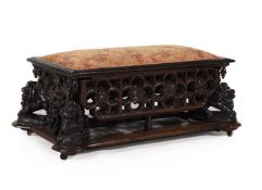 A CARVED OAK OTTOMAN STOOL, IN THE ANTIQUARIAN TASTE, 19TH CENTURY