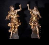 A LARGE PAIR OF FRANCO-ITALIAN CARVED, GILDED AND POLYCHROME ANGELS, MID 18TH CENTURY