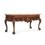 A CARVED WALNUT AND MARBLE MOUNTED CONSOLE TABLE, IN IRISH GEORGE II STYLE