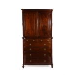 A GEORGE IV MAHOGANY AND BRASS INLAID BOWFRONT SECRETAIRE CLOTHES PRESS, CIRCA 1825