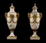 A LARGE PAIR OF FRENCH MARBLE AND ORMOLU MOUNTED NEOCLASSICAL URNS, EARLY 20TH CENTURY