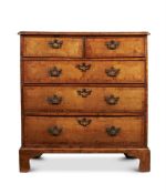 A GEORGE II WALNUT, PINE AND FRUITWOOD CROSSBANDED CHEST OF DRAWERS, CIRCA 1740