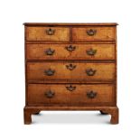 A GEORGE II WALNUT, PINE AND FRUITWOOD CROSSBANDED CHEST OF DRAWERS, CIRCA 1740