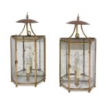 A PAIR OF GLAZED, BRASS FRAMED AND MIRROR BACKED WALL LANTERNS, 20TH CENTURY