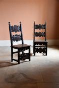 A MATCHED PAIR OF ITALIAN CARVED WALNUT CHAIRS, PROBABLY LOMBARDY, 17TH CENTURY