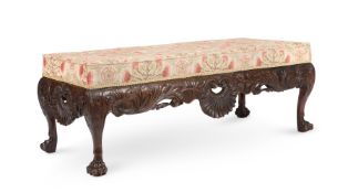AN IRISH CARVED MAHOGANY AND UPHOLSTERED STOOL, IN MID 18TH CENTURY STYLE, LATE 19TH CENTURY