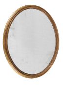 A GILTWOOD OVAL WALL MIRROR, FIRST HALF 19TH CENTURY