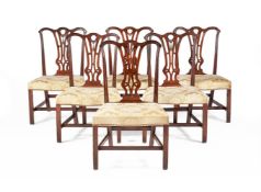 A SET OF SIX GEORGE III MAHOGANY DINING CHAIRS, IN THE MANNER OF THOMAS CHIPPENDALE, CIRCA 1770