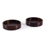 A PAIR OF TURNED MAHOGANY WINE COASTERS, IN GEORGE III STYLE