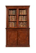 AN UNUSUAL REGENCY POLLARD OAK AND EBONISED BOOKCASE CABINET, CIRCA 1820