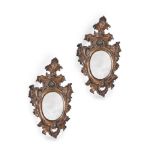 A PAIR OF ITALIAN CARVED GILTWOOD WALL MIRRORS, PROBABLY VENETIAN, FIRST HALF 18TH CENTURY