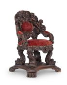 AN ITALIAN CARVED OAK 'THRONE' CHAIR, IN THE MANNER OF BRUSTOLON, LATE 19TH CENTURY