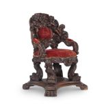 AN ITALIAN CARVED OAK 'THRONE' CHAIR, IN THE MANNER OF BRUSTOLON, LATE 19TH CENTURY